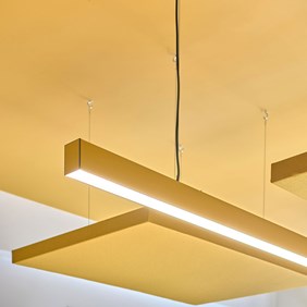 SLIDER profile system in yellow – individual LED ceiling light for creative office design and continuous light lines